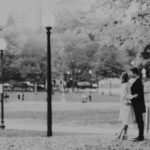 B&W photo of a couple in love, and newly engaged in the Boston Common -a dreamy adventure engagement photo in black and white